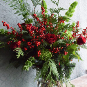 Photo showing a sample of a festive vase arrangement available to order from Kensington Flowers London