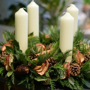 Photo showing a Kensington Advent wreath, florist choice of decoration available from Kensington flowers London