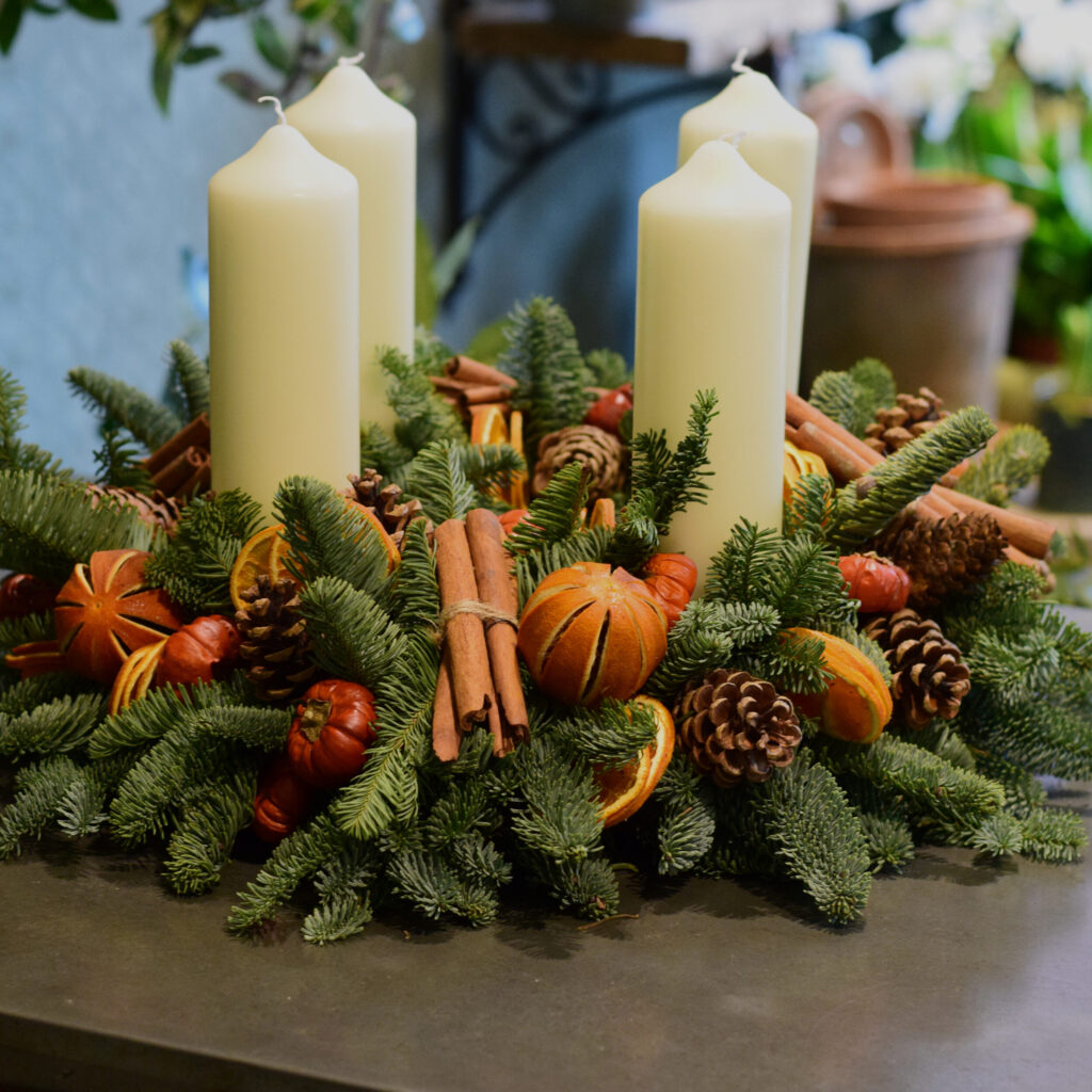 Sample of The Luxury Victoria Christmas Advent wreath orange fruits, cones and cinnamon available to order from Kensington flowers London