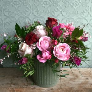 Photo showing a sample of a seasonal rose vase arrangement in pinks and reds available to order from Kensington Flowers London